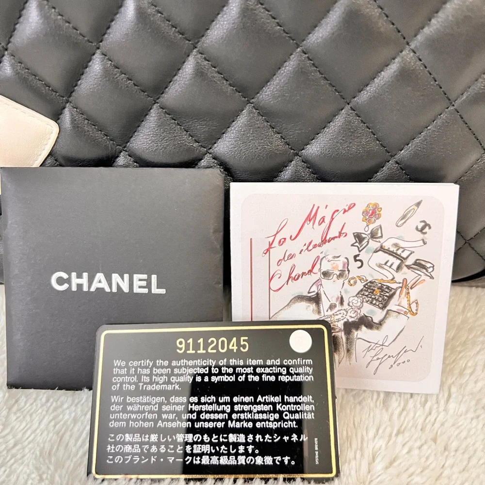 CHANEL Black Quilted Leather Shoulder Tote with White CC Emblem